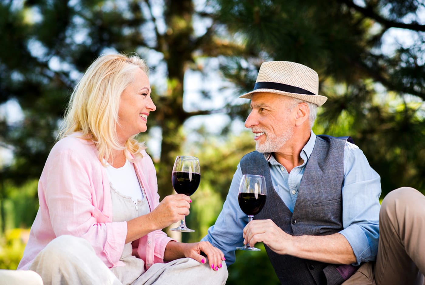 Mature couple enjoying wine outdoors — Sequel Dating App blog