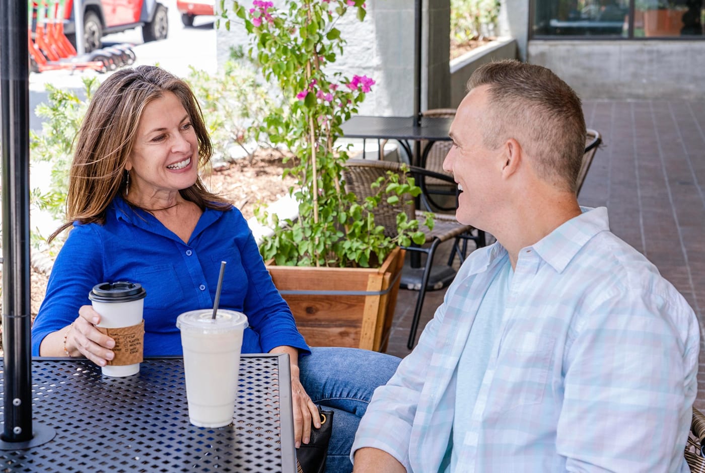 Mature woman enjoying a cup of tea and an online conversation